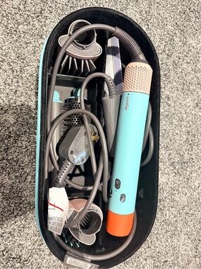 Dyson multi-attachment styler in aqua, coral and rose gold